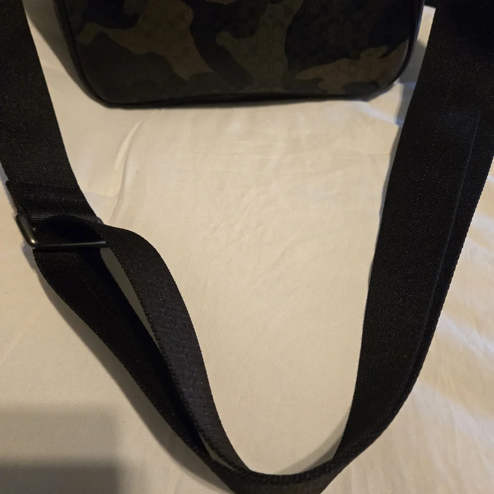 Coach zip strap embossed